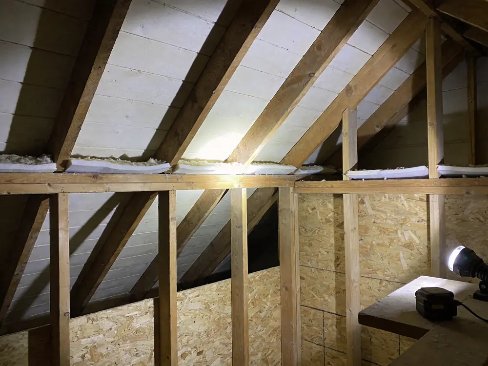Attic sheathing cleaned back to bare wood after remediation