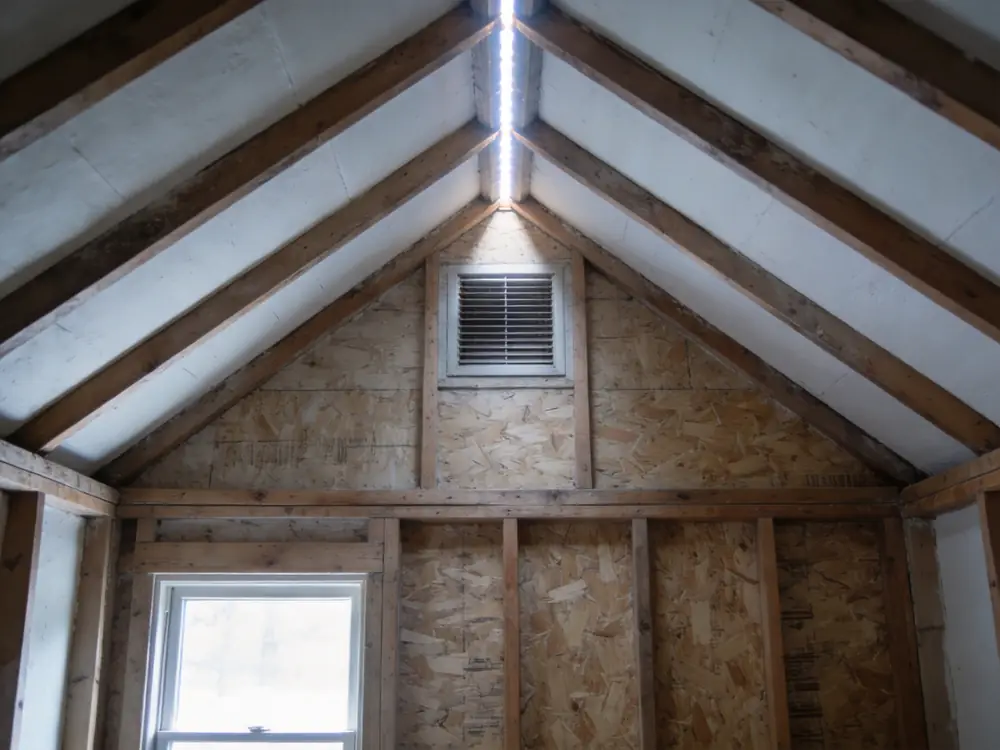 Daylight through a ridge vent along an attic peak