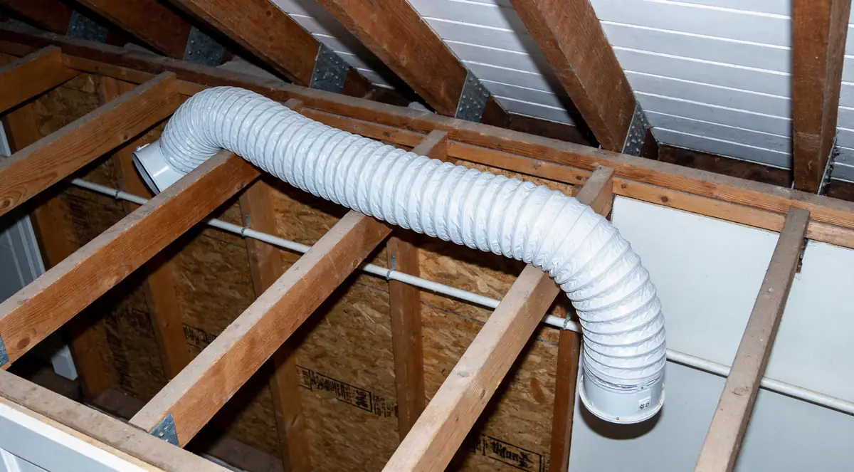 Bathroom exhaust duct venting into an attic instead of outside