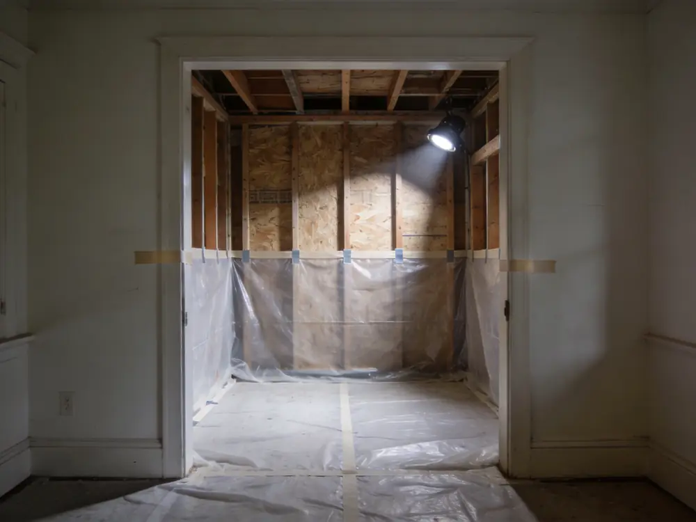 Poly sheeting taped floor to ceiling across an opening