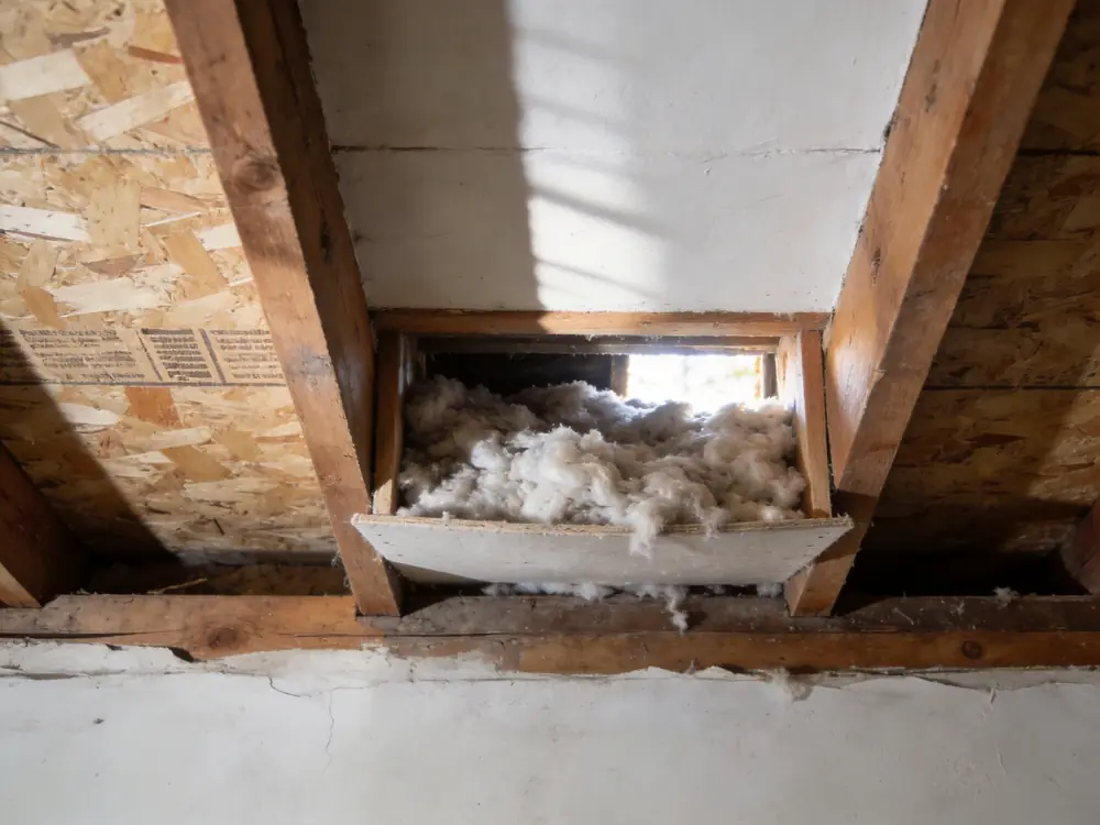 Attic soffit vent blocked by insulation at the eave