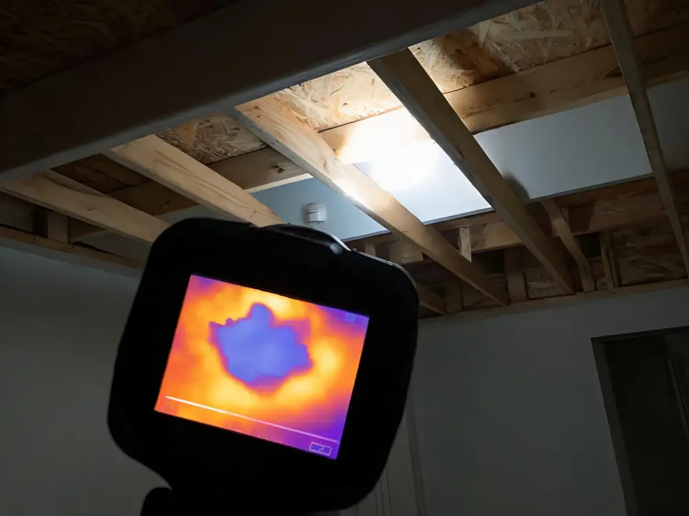 Thermal imaging camera showing a cool patch on a ceiling