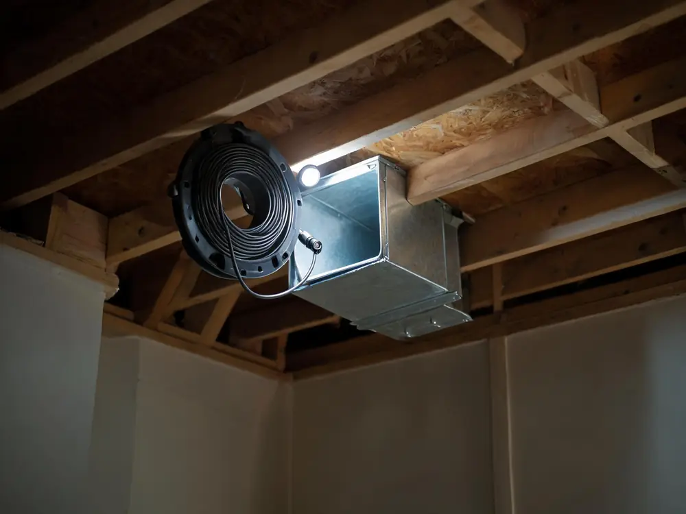Duct inspection camera beside an open trunk line