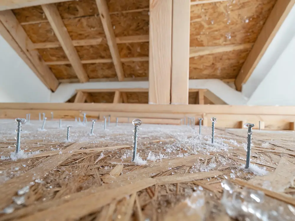 Condensation and frost on the underside of attic roof sheathing