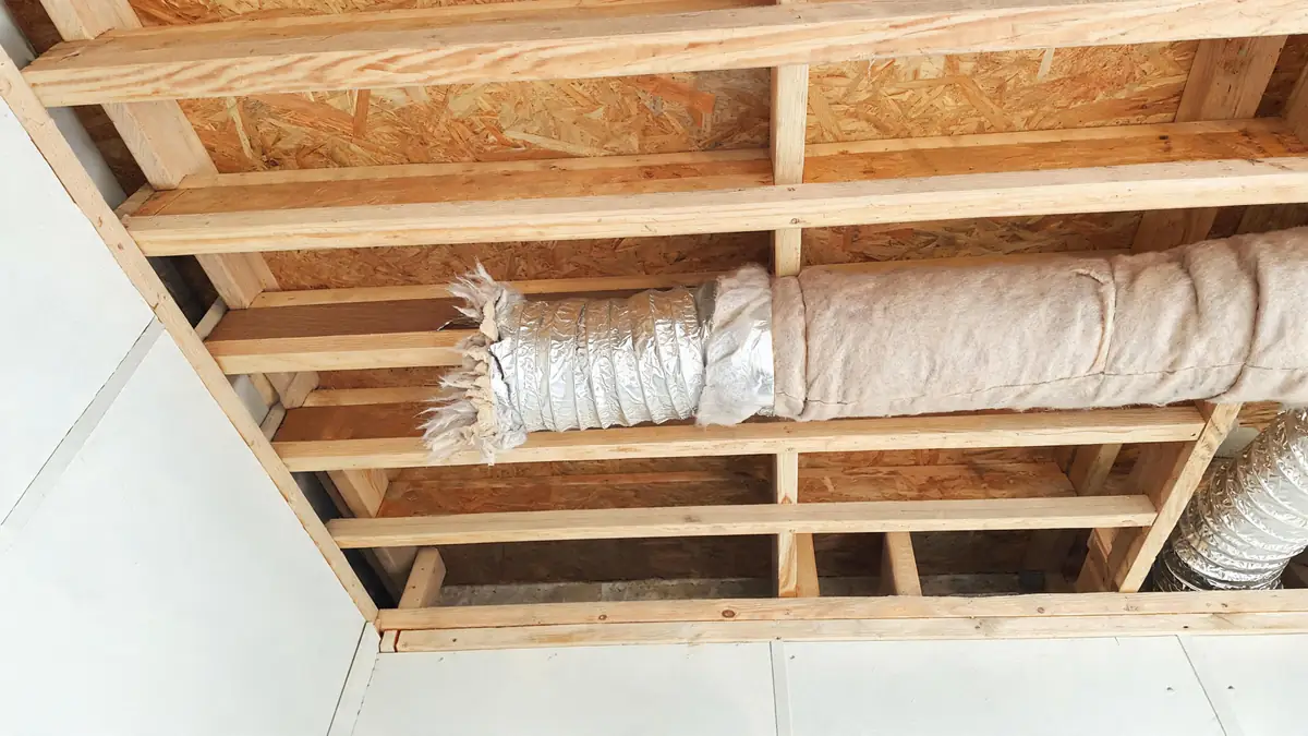 Flexible ductwork with its insulation jacket torn open