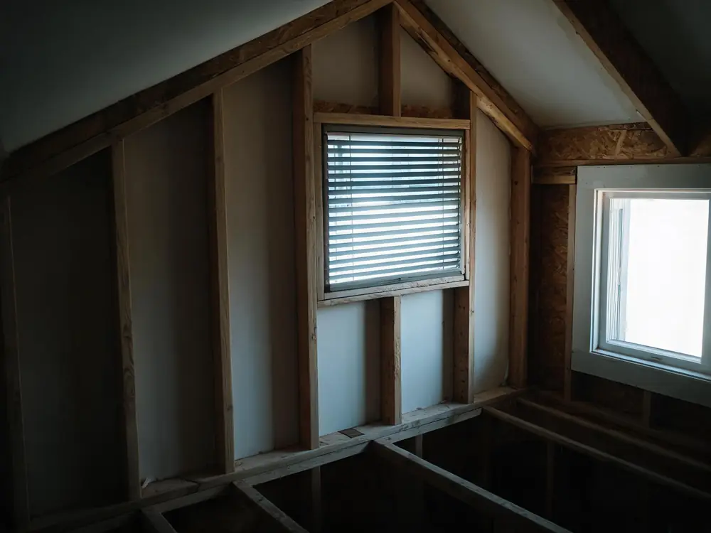 Gable vent seen from inside a dim attic