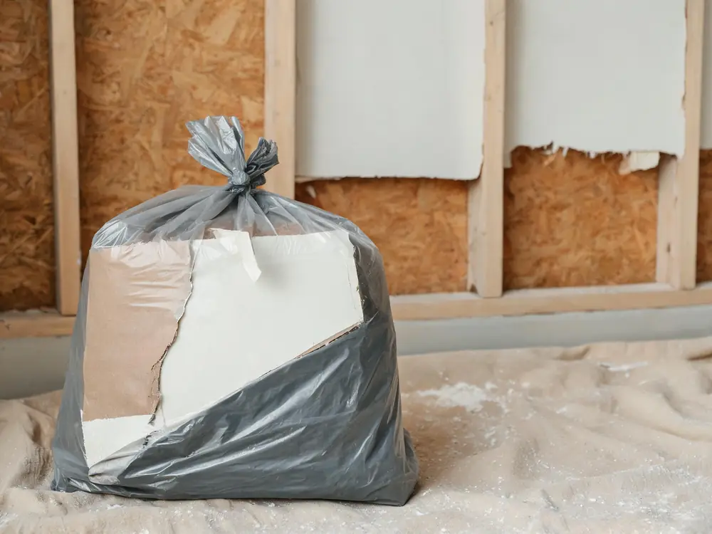 Bagged and sealed drywall removed during remediation